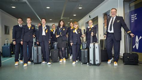 STEP UP: Lufthansa crew takes to the skies Adidas .